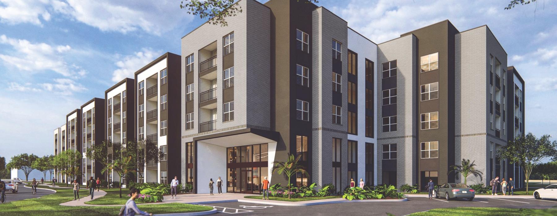 a person riding a bicycle in front of a building