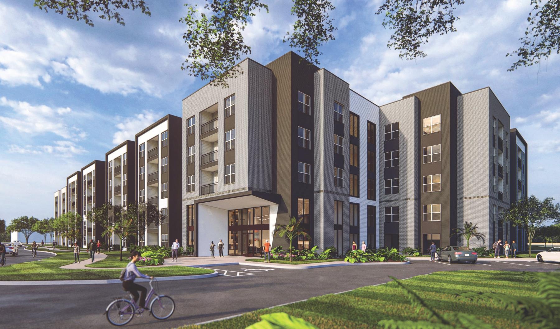 a person riding a bicycle in front of a building