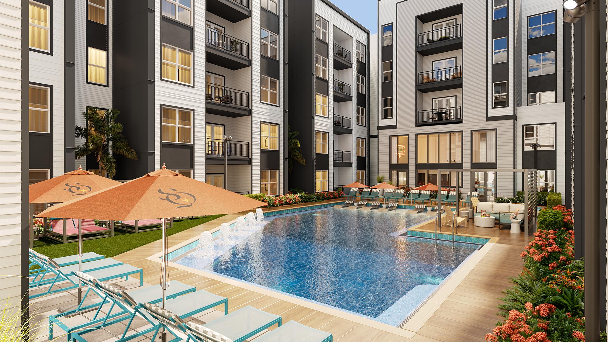 Sterling Quadrangle A courtyard swimming pool with fountains, surrounded by lounge chairs, patio umbrellas, and a modern multi-story apartment building.