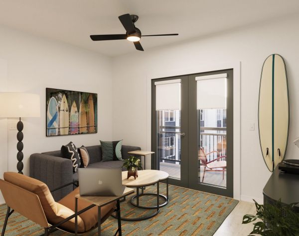 Sterling Quadrangle Modern living room with a gray sofa, armchair, surfboard, TV, and glass doors leading to a balcony. Bedroom visible through open door.